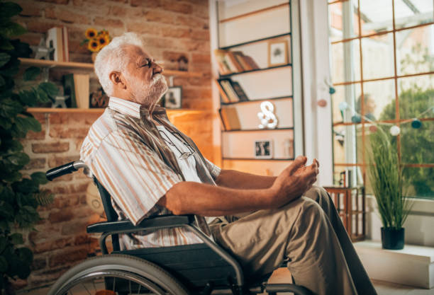 istock grandfather practices meditation at home 1330327308