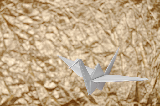 White Origami On Golden Background