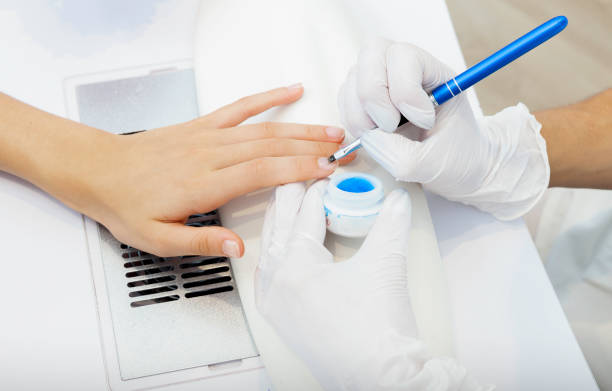 istock Closeup of a beautician applying polish 1330335936
