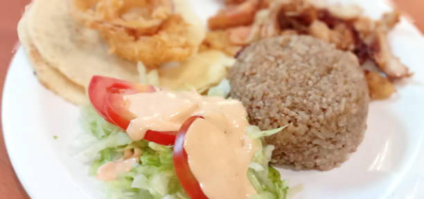 istock Spiced Rice Chicken with Cane, Onion Ring and Salad 1330336738