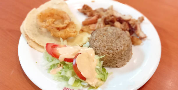 istock Spiced Rice Chicken with Cane, Onion Ring and Salad 1330336754