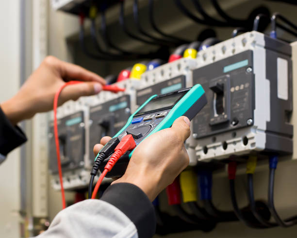 istock An electrical engineer is investigating an electrical control cabinet maintenance concept. 1330338188