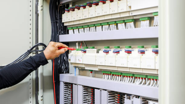 istock An electrical engineer is investigating an electrical control cabinet maintenance concept. 1330338198