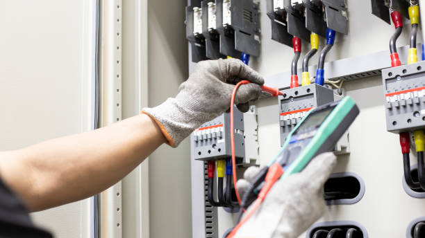 istock An electrical engineer is investigating an electrical control cabinet maintenance concept. 1330338206