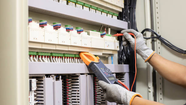 istock An electrical engineer is investigating an electrical control cabinet maintenance concept. 1330338208