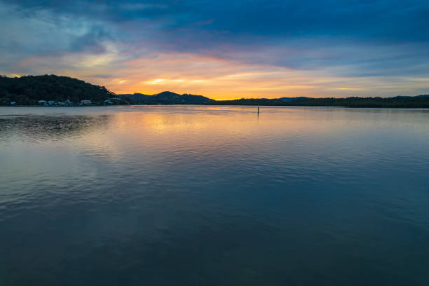 istock High cloud covered winter sunrise waterscape 1330345711