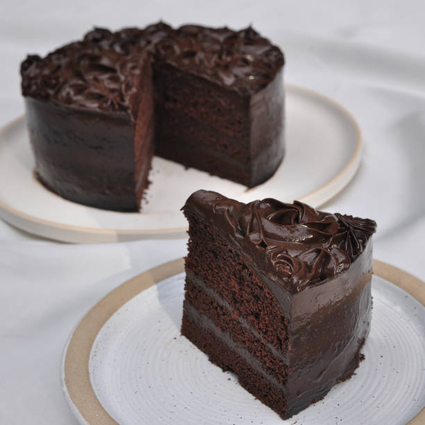 istock Sliced homemade chocolate cake on white dish 1330345801