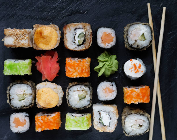 istock Set of sushi and maki on stone table 1330351228