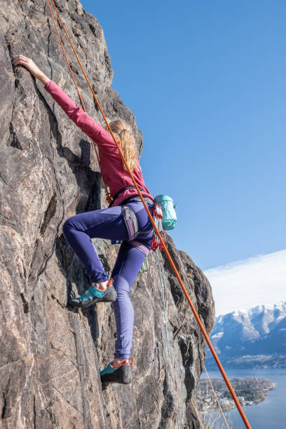 istock Mountain climber ascend rock face 1330352358