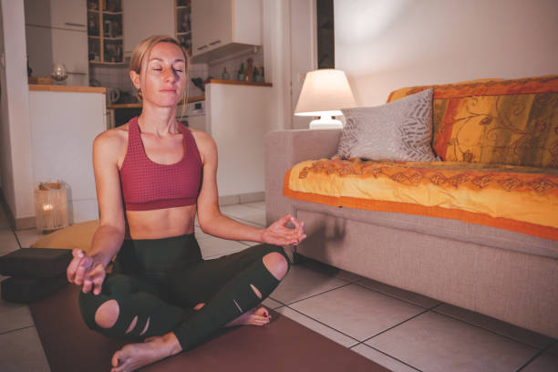 istock Woman practices meditation at home 1330353079