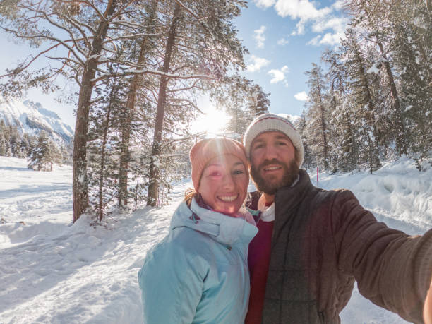 istock Couple take selfie in winter wonderland 1330353646