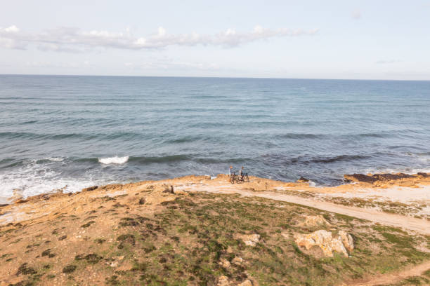 istock Drone view of bikers on the coastline 1330354248