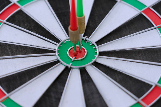istock dart hit center of target. 1330355839