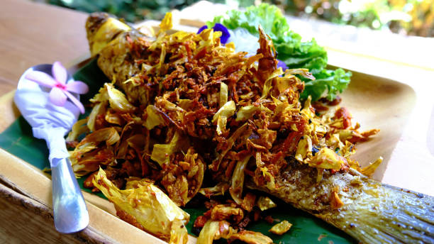 istock Deep fried whole fish with turmeric and garlic 1330356753