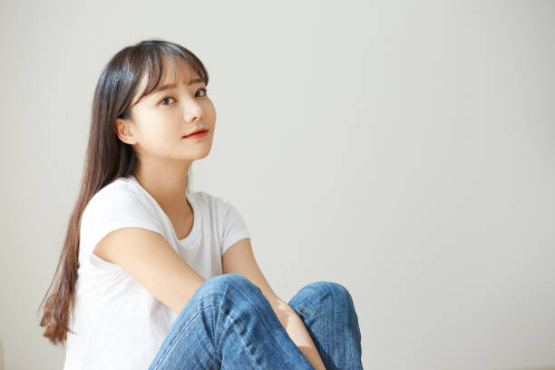 A young Asian woman in a white T-shirt fashion, beauty japanese woman stock pictures, royalty-free photos & images