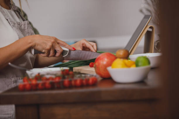 istock Cutting up fresh cherry tomatoes for a salad 1330358914