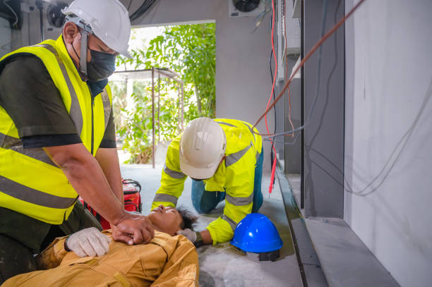 istock Electric worker suffered an electric shock accident unconscious. Safety team CPR for first aid Electric worker loses in electric shock accident at work on site. 1330359241