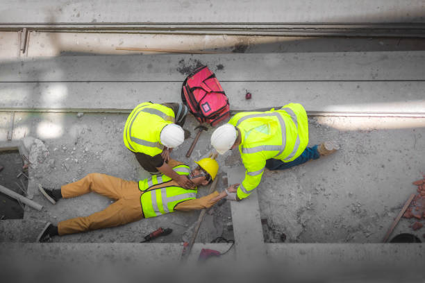 istock Basic First aid and CPR for Emergency Accidents at Construction Sites. Construction worker was injured in a fall from a height at construction site. 1330359281