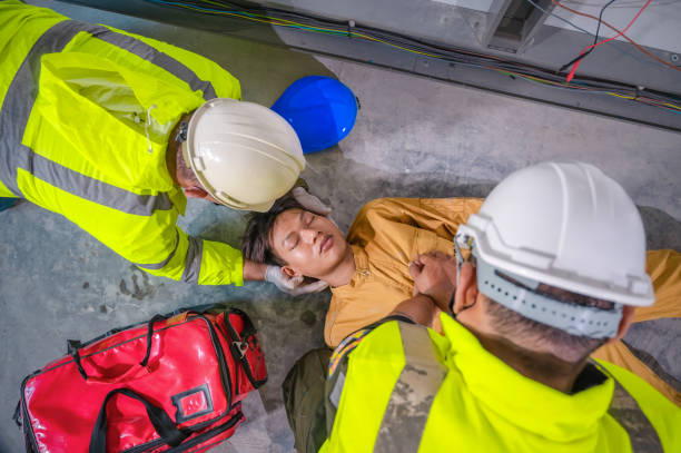 istock Electric worker suffered an electric shock accident unconscious. Safety team CPR for first aid Electric worker loses in electric shock accident at work on site. 1330359294