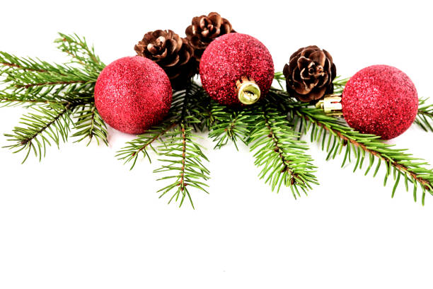 istock Christmas festive composition with fir branches and red decorative balls an isolated white background. 1330360224