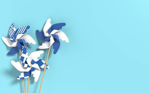 istock Greek Flag on White Paper Flower Windmills on Blue Background 1330360621