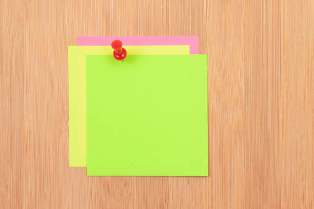 istock Colored Sticky Notes Pinned to the Wooden Message Board 1330361377