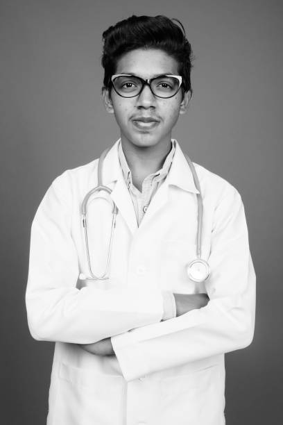 istock Young Indian boy doctor with eyeglasses in black and white 1330362285