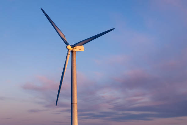 istock Wind generator for generating renewable electricity against the backdrop of a beautiful sunset sky with beautiful clouds close-up 1330363749