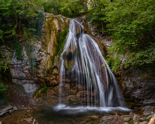 istock small mountain waterfall in the green forest 1330363780