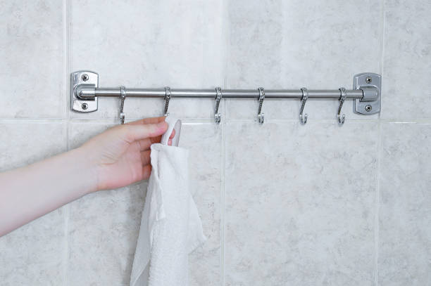istock Hangs a white towel on a metal hanger in bathroom. 1330366507