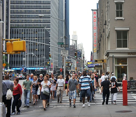 A large group of people walking on the 6th avenue. NYC, USA