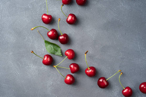 istock Fresh cherry with leaves on a wooden table Free space Horizontal image 1330368022