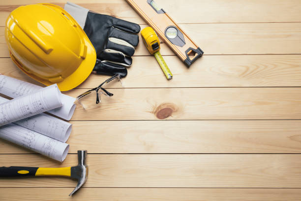 istock Work safety. Standard Construction site protective equipment on  top view wooden background, flat lay, copy space,safety first concepts. 1330368541