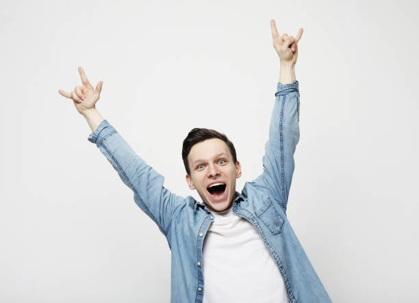istock Happy young handsome man gesturing and keeping mouth 1330371262