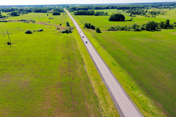 istock Highway through fields and arable land. View from above. Summer rural landscape 1330373428