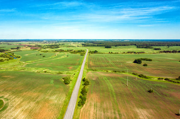 istock Highway through fields and arable land. View from above. Summer rural landscape 1330373443