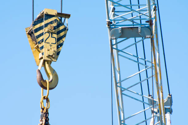 istock Tower crane hook against the blue sky. Close up photo. 1330375011