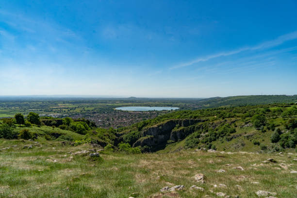 CHEDDAR GORGE IN SOMERSET View from the top of Cheddar Gorge with reservoir in distance. cheddar gorge stock pictures, royalty-free photos & images