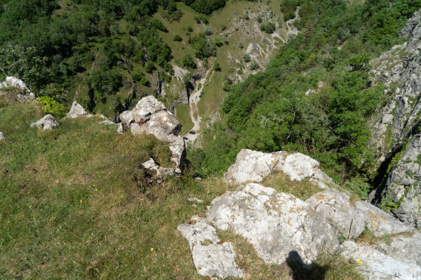 Cheddar Gorge in Somerset Looking down from The cliff faces at the edge of Cheddar Gorge in Somerset cheddar gorge stock pictures, royalty-free photos & images