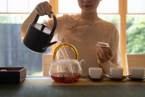 istock women show tea ceremony 1330377403