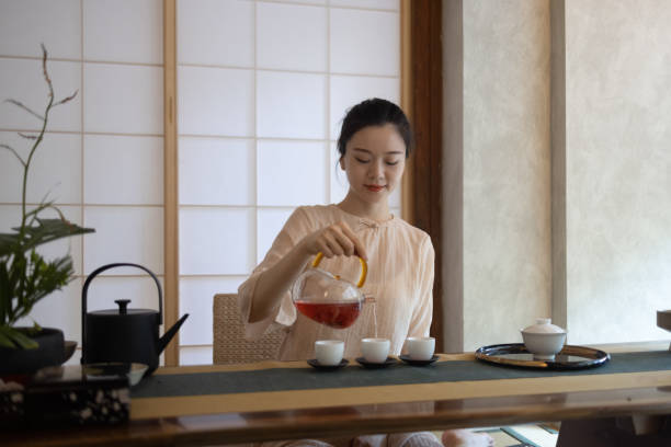 istock Asian women making tea 1330377476
