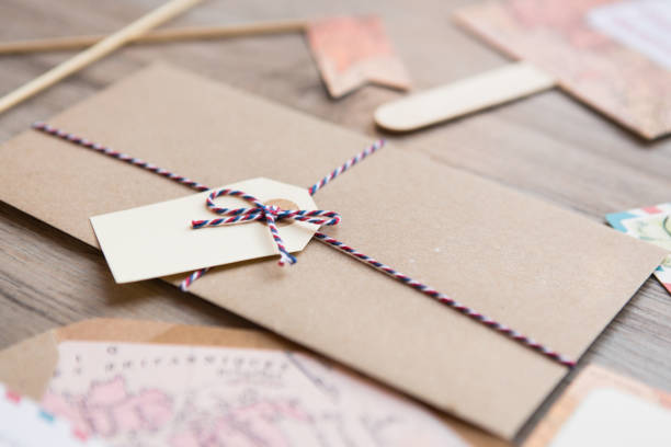 istock Detail of beatiful cardboard envelope with tag. 1330383873