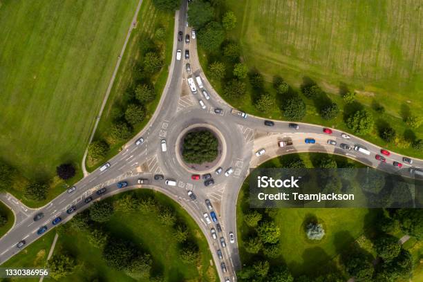 Aerial View Of Busy Roundabout Junction At Rush Hour Stock Photo - Download Image Now