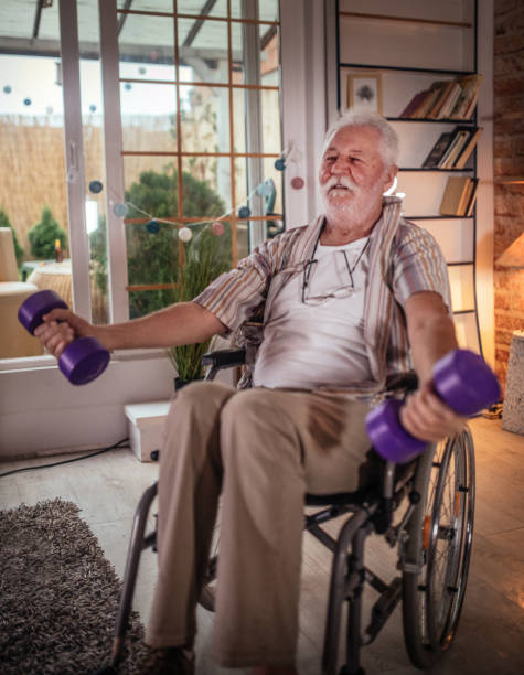 istock Disabled Man Lifting Dumbbells at home 1330388038