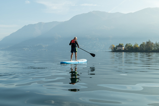 Man paddling on a stand up paddle board