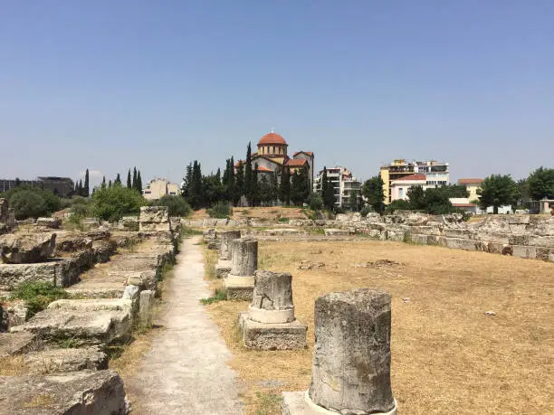 Photo of The ruins of the Pompeion at Kerameikos, also known as Ceramicus, in Athens, Greece. It was the potters' quarter of the city and was also the site of an important cemetery and numerous funerary sculptures erected along the Sacred Way.