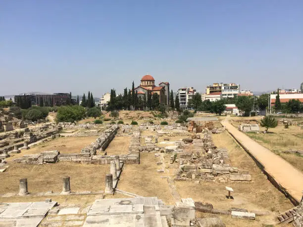 Photo of The ruins of the Pompeion at Kerameikos, also known as Ceramicus, in Athens, Greece. It was the potters' quarter of the city and was also the site of an important cemetery and numerous funerary sculptures erected along the Sacred Way.