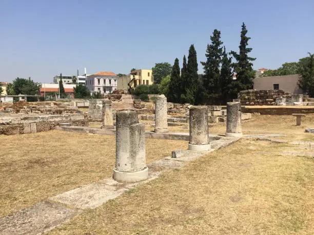 Photo of The ruins of the Pompeion at Kerameikos, also known as Ceramicus, in Athens, Greece. It was the potters' quarter of the city and was also the site of an important cemetery and numerous funerary sculptures erected along the Sacred Way.