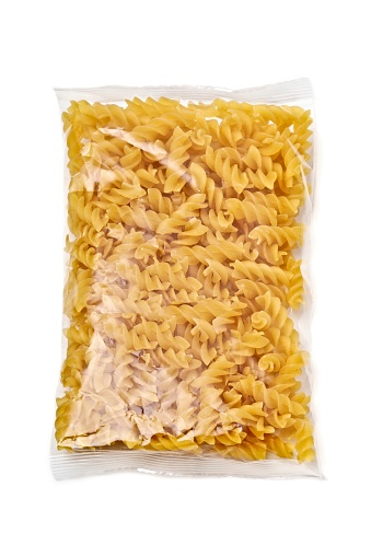 Fusili pasta in plastic package isolated in white background.