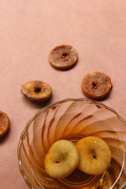 Dried and soaked figs close-up Dried figs and figs soaked in water overnight drenched stock pictures, royalty-free photos & images